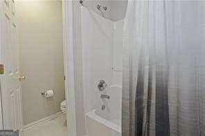 210 Cottonwood Creek Cir, Canton, GA 30114 - full bathroom featuring shower / tub combo and toilet