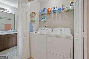 210 Cottonwood Creek Cir, Canton, GA 30114 - laundry room featuring washer and dryer
