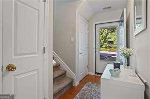 210 Cottonwood Creek Cir, Canton, GA 30114 - doorway featuring stairs, dark wood-type flooring, and baseboards