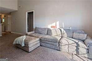 210 Cottonwood Creek Cir, Canton, GA 30114 - living room featuring carpet flooring and baseboards