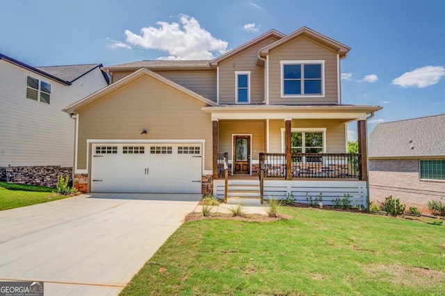 traditional-style house with a porch, an attached garage, concrete driveway, a front lawn, and stone siding