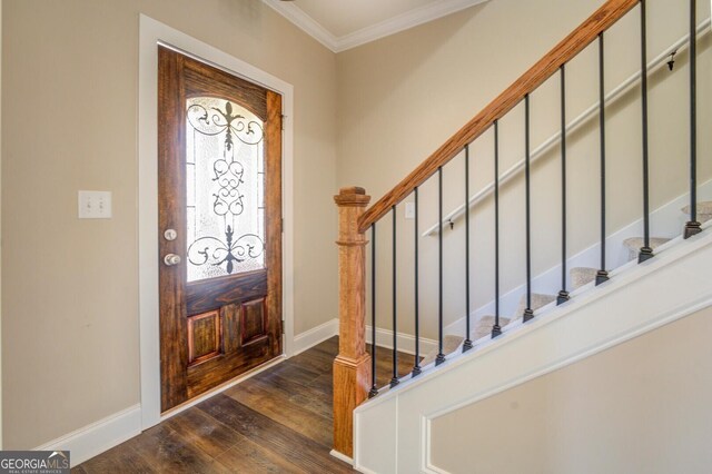 foyer entrance featuring dark wood-style floors, ornamental molding, stairs, and baseboards