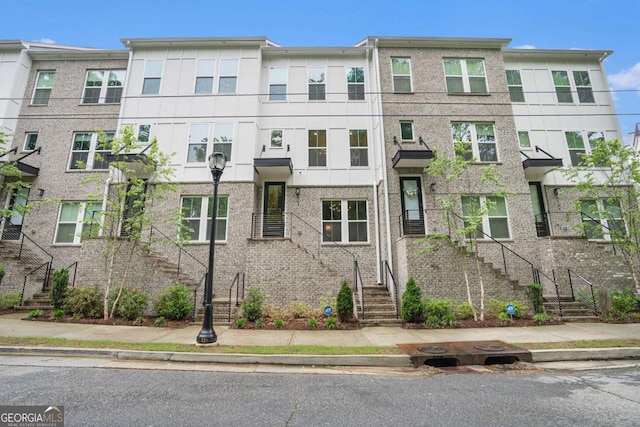 2505 Astaire Ct NW, Atlanta, GA 30318 - view of front of property with stairway and stucco siding