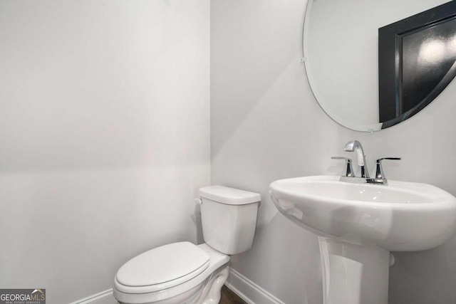 2505 Astaire Ct NW, Atlanta, GA 30318 - bathroom with baseboards and toilet