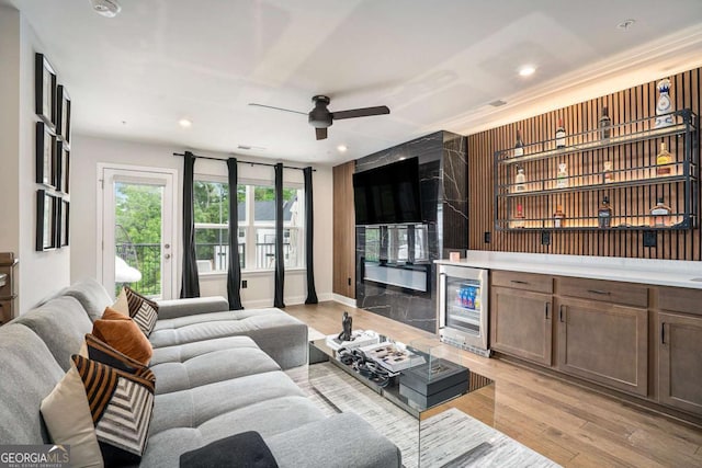 2505 Astaire Ct NW, Atlanta, GA 30318 - living room featuring wine cooler, bar area, a ceiling fan, light wood-type flooring, and recessed lighting