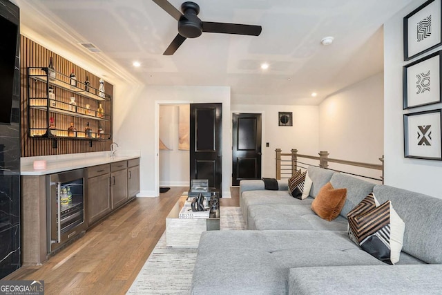 2505 Astaire Ct NW, Atlanta, GA 30318 - living room with wine cooler, bar area, wood finished floors, a ceiling fan, and recessed lighting