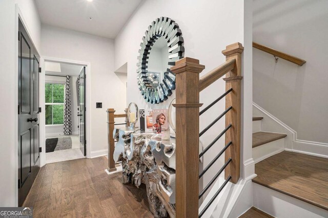 2505 Astaire Ct NW, Atlanta, GA 30318 - hallway with dark wood-type flooring, stairway, and baseboards