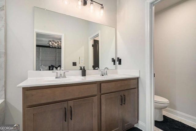 2505 Astaire Ct NW, Atlanta, GA 30318 - bathroom featuring double vanity and toilet