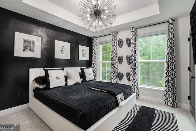 2505 Astaire Ct NW, Atlanta, GA 30318 - bedroom with baseboards, a chandelier, a raised ceiling, and carpet floors