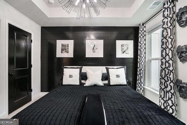 2505 Astaire Ct NW, Atlanta, GA 30318 - unfurnished bedroom featuring multiple windows, carpet floors, and a chandelier