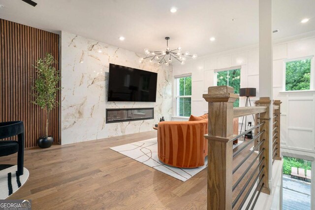 2505 Astaire Ct NW, Atlanta, GA 30318 - living area featuring wood finished floors, a chandelier, plenty of natural light, and recessed lighting