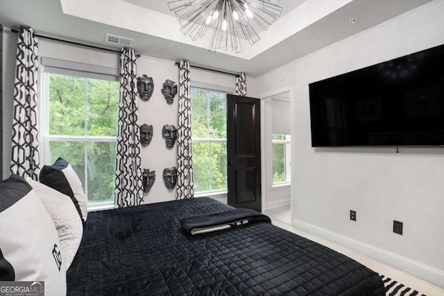 2505 Astaire Ct NW, Atlanta, GA 30318 - bedroom featuring baseboards, carpet, and a chandelier