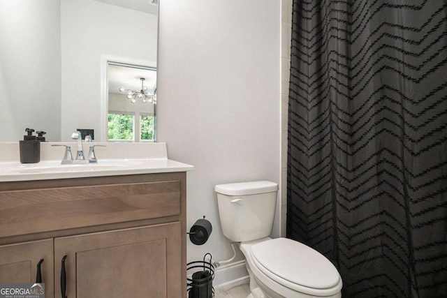 2505 Astaire Ct NW, Atlanta, GA 30318 - bathroom with toilet, vanity, curtained shower, and a chandelier