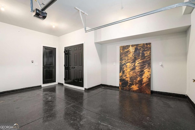 2505 Astaire Ct NW, Atlanta, GA 30318 - garage with baseboards and a garage door opener