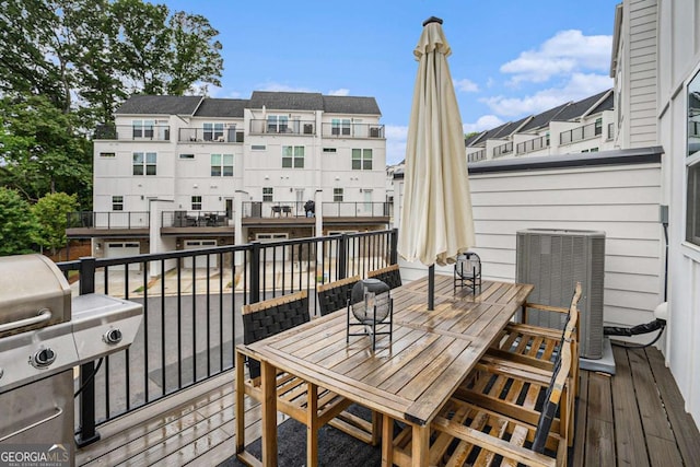 2505 Astaire Ct NW, Atlanta, GA 30318 - wooden terrace featuring central AC unit, outdoor dining space, and a grill