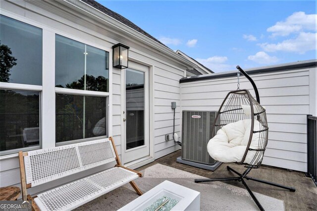 2505 Astaire Ct NW, Atlanta, GA 30318 - view of patio featuring central air condition unit and an outdoor fire pit