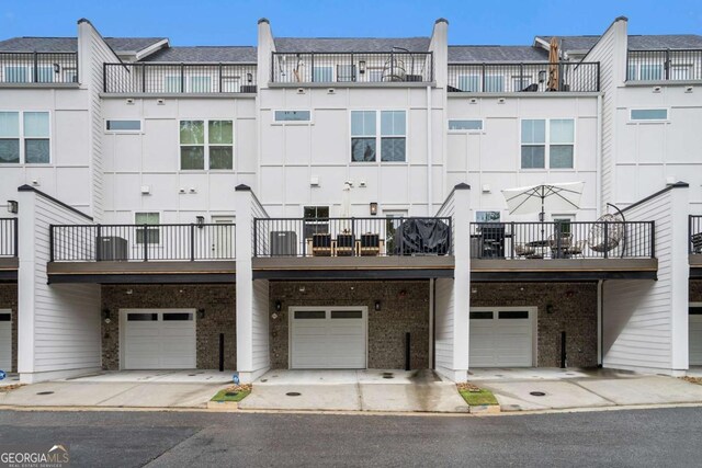 2505 Astaire Ct NW, Atlanta, GA 30318 - view of building exterior with a garage and driveway