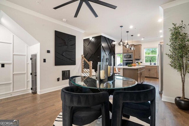 2505 Astaire Ct NW, Atlanta, GA 30318 - dining space with a ceiling fan, dark wood finished floors, baseboards, crown molding, and recessed lighting