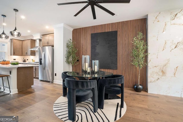 2505 Astaire Ct NW, Atlanta, GA 30318 - dining space featuring an accent wall, ceiling fan, light wood finished floors, and recessed lighting