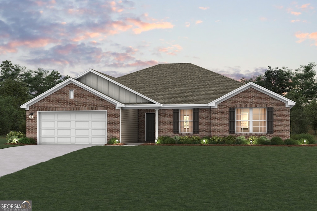 303 Gazebo Dr, Bonaire, GA 31005 - view of front of home with board and batten siding, brick siding, driveway, and a front lawn