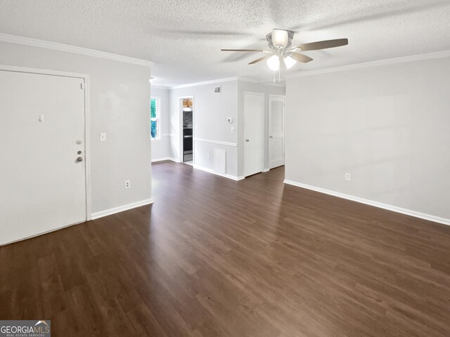 entrance foyer with a ceiling fan, crown molding, dark wood finished floors, a textured ceiling, and baseboards