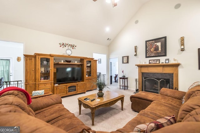 living room featuring high vaulted ceiling, light carpet, ceiling fan, and a fireplace