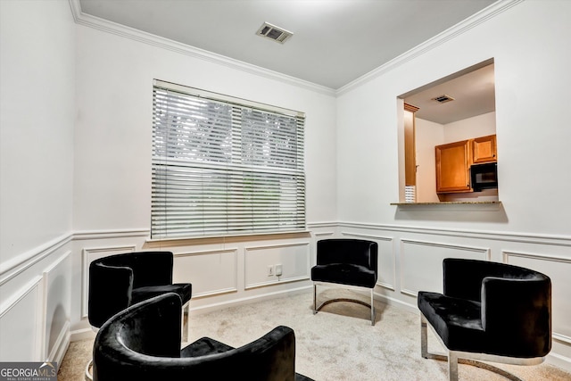 547 SE Tufton Trl SE, Atlanta, GA 30354 - living area with carpet, crown molding, a decorative wall, and wainscoting