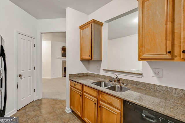 547 SE Tufton Trl SE, Atlanta, GA 30354 - kitchen with black dishwasher, light stone counters, and brown cabinets