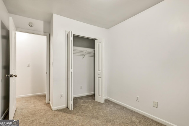 547 SE Tufton Trl SE, Atlanta, GA 30354 - unfurnished bedroom with light carpet and a closet