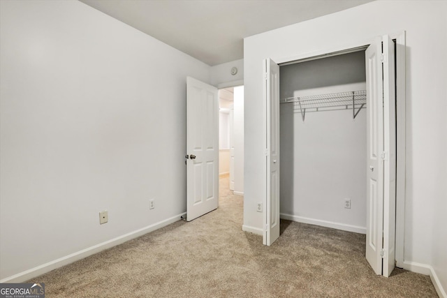 547 SE Tufton Trl SE, Atlanta, GA 30354 - unfurnished bedroom with carpet floors and a closet