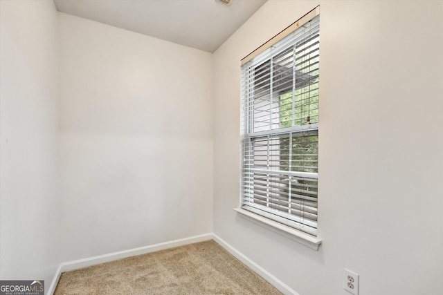 547 SE Tufton Trl SE, Atlanta, GA 30354 - carpeted spare room with baseboards