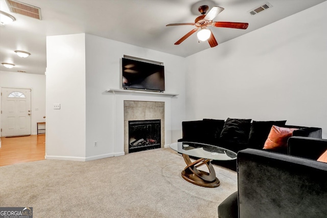 547 SE Tufton Trl SE, Atlanta, GA 30354 - living room with carpet, a ceiling fan, and a fireplace