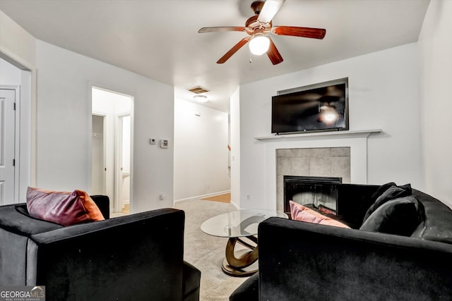 547 SE Tufton Trl SE, Atlanta, GA 30354 - carpeted living room with ceiling fan and a fireplace