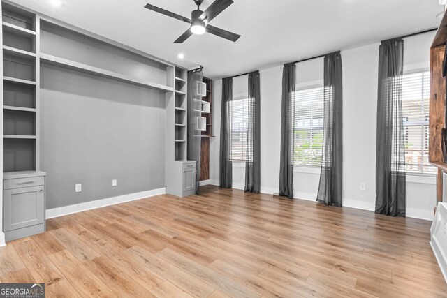 4462 Dandelion Ln, Atlanta, GA 30342 - unfurnished living room with ceiling fan, light wood-type flooring, baseboards, and recessed lighting