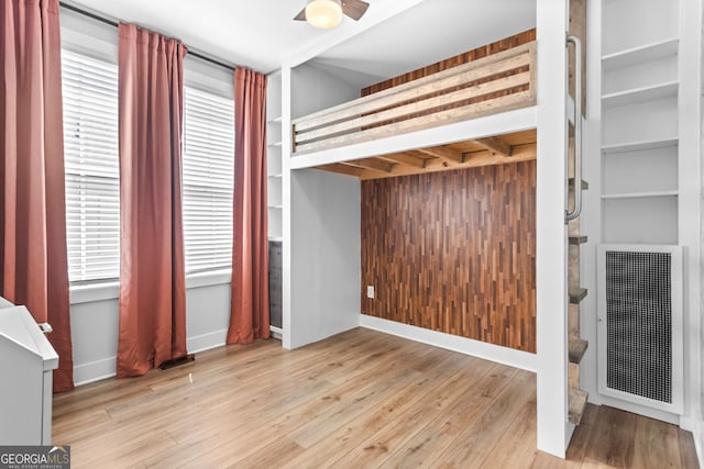 4462 Dandelion Ln, Atlanta, GA 30342 - unfurnished bedroom featuring wood finished floors and baseboards