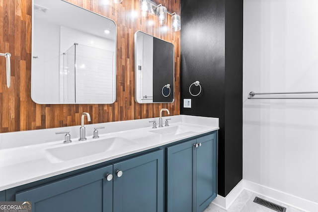 4462 Dandelion Ln, Atlanta, GA 30342 - bathroom with double vanity and baseboards