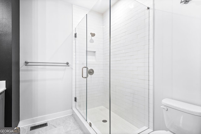 4462 Dandelion Ln, Atlanta, GA 30342 - full bathroom featuring baseboards, toilet, a shower stall, vanity, and marble finish floors