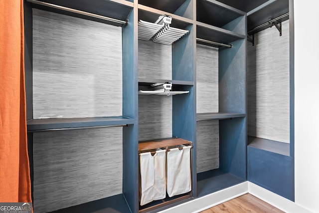4462 Dandelion Ln, Atlanta, GA 30342 - walk in closet featuring wood finished floors