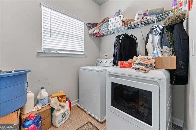 6237 Thorncrest Dr Unit 10, Tucker, GA 30084 - clothes washing area featuring washer and clothes dryer, baseboards, and light wood finished floors