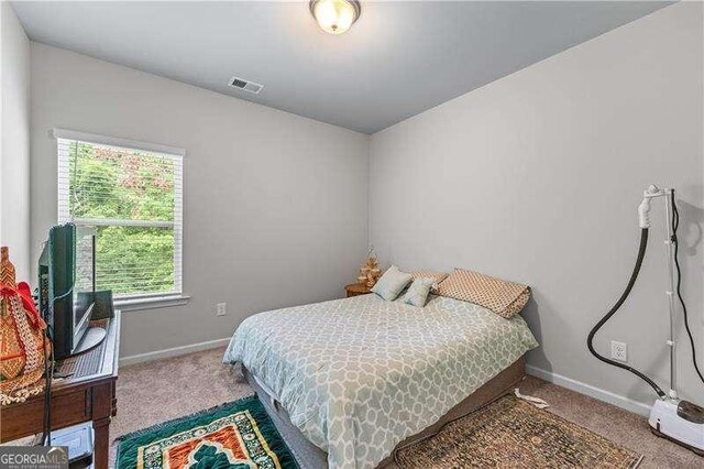 6237 Thorncrest Dr Unit 10, Tucker, GA 30084 - bedroom featuring carpet flooring and baseboards