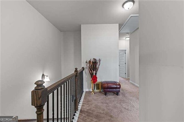 6237 Thorncrest Dr Unit 10, Tucker, GA 30084 - hall with attic access, carpet floors, an upstairs landing, and baseboards