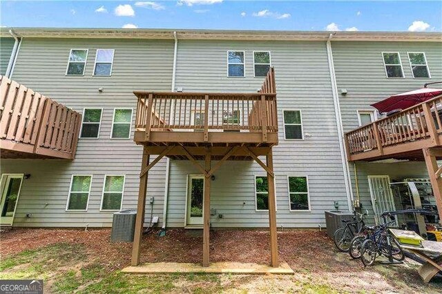 6237 Thorncrest Dr Unit 10, Tucker, GA 30084 - back of house with central AC and a wooden deck