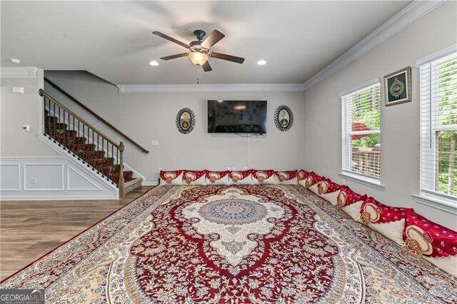 6237 Thorncrest Dr Unit 10, Tucker, GA 30084 - living area with wood finished floors, plenty of natural light, stairs, ornamental molding, and a ceiling fan