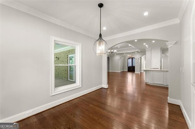 5816 Chamblee Dunwoody, Atlanta, GA 30338 - unfurnished dining area with arched walkways, baseboards, dark wood finished floors, ornamental molding, and a chandelier