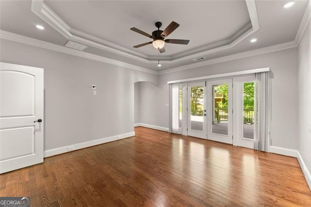 5816 Chamblee Dunwoody, Atlanta, GA 30338 - empty room with a raised ceiling, a ceiling fan, ornamental molding, wood finished floors, and arched walkways