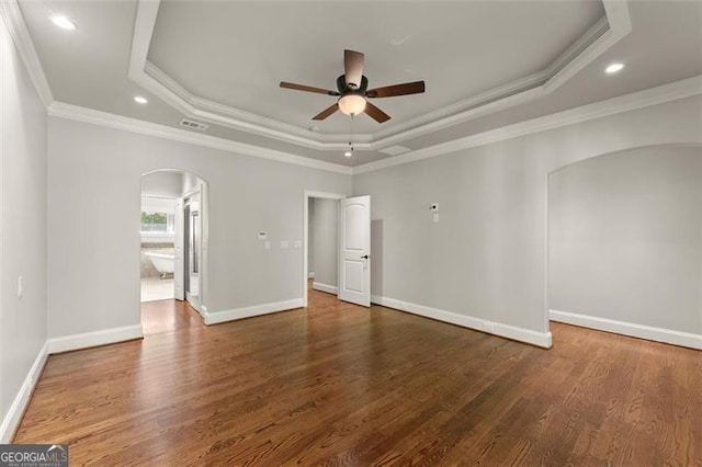 5816 Chamblee Dunwoody, Atlanta, GA 30338 - unfurnished room featuring arched walkways, a raised ceiling, ceiling fan, ornamental molding, and wood finished floors