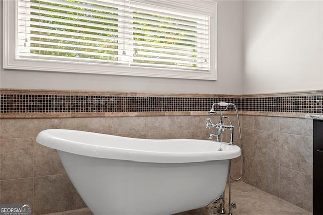 5816 Chamblee Dunwoody, Atlanta, GA 30338 - full bathroom featuring tile walls, a freestanding tub, and a wainscoted wall