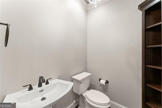 5816 Chamblee Dunwoody, Atlanta, GA 30338 - half bath featuring a sink, toilet, crown molding, and baseboards