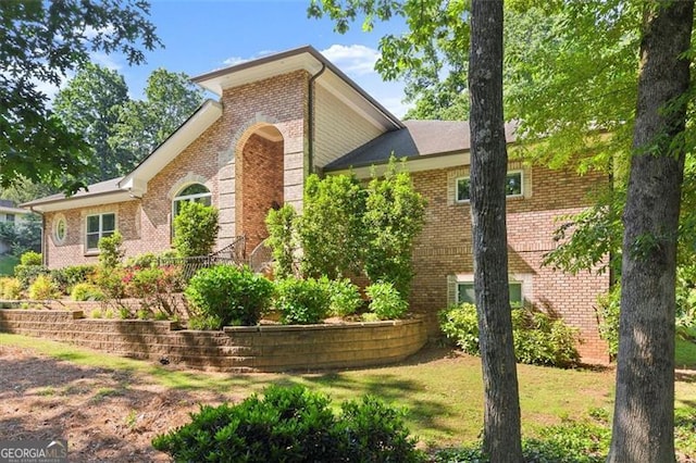 5816 Chamblee Dunwoody, Atlanta, GA 30338 - view of property exterior with brick siding and a lawn
