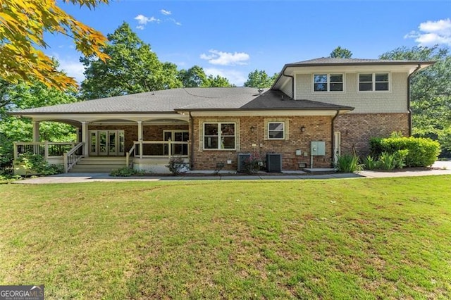 5816 Chamblee Dunwoody, Atlanta, GA 30338 - rear view of house featuring a lawn, brick siding, and central air condition unit